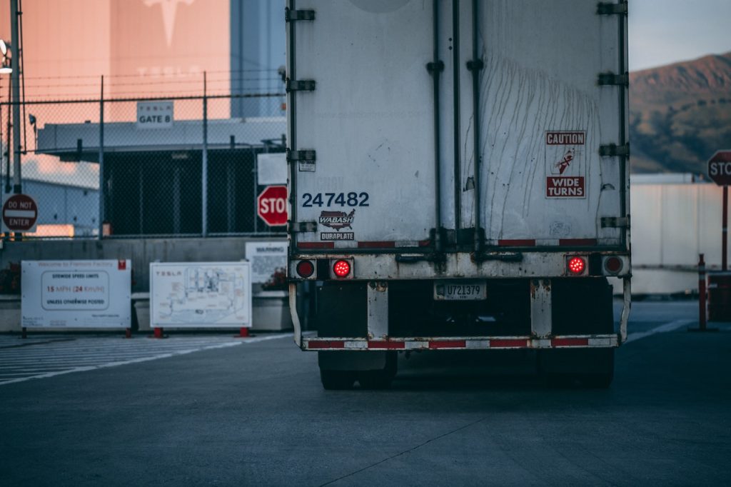 picutre of the back of a semi truck on a road